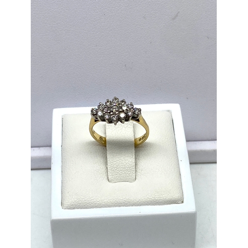 223 - An 18ct yellow gold cluster dress ring, approx 0.60ct diamond, weight is 2.7 grams approx, size F