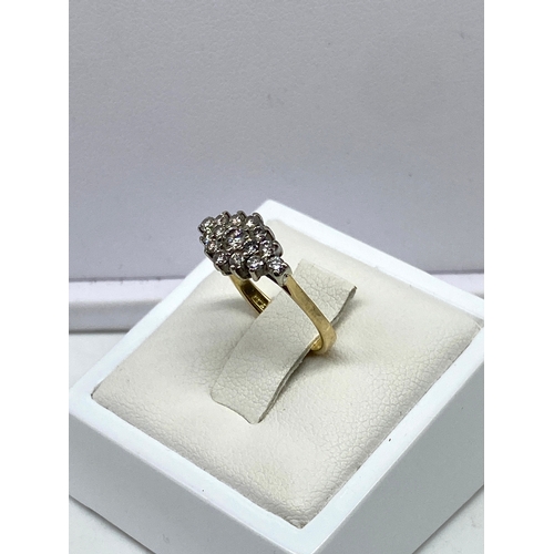 223 - An 18ct yellow gold cluster dress ring, approx 0.60ct diamond, weight is 2.7 grams approx, size F