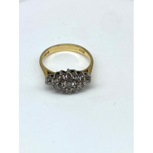 223 - An 18ct yellow gold cluster dress ring, approx 0.60ct diamond, weight is 2.7 grams approx, size F