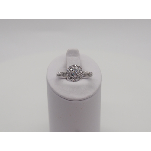 230 - A new platinum + diamond ring, centre stone is 0.50ct, shoulder diamonds 0.20ct, clarity G/VS, new c... 