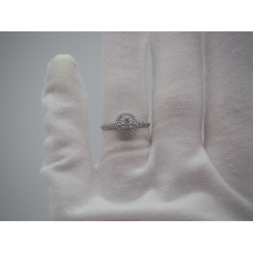 230 - A new platinum + diamond ring, centre stone is 0.50ct, shoulder diamonds 0.20ct, clarity G/VS, new c... 