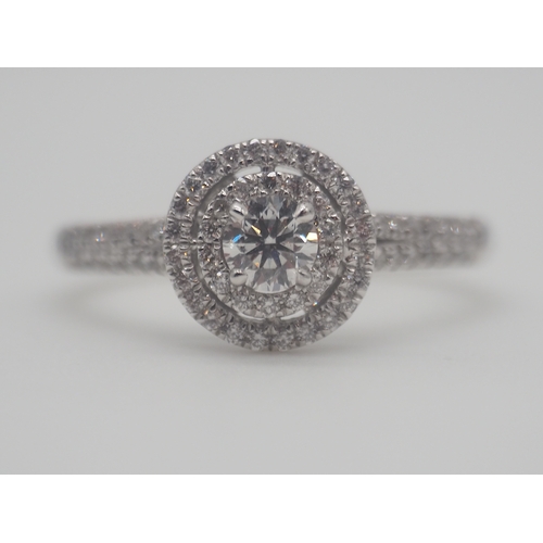 230 - A new platinum + diamond ring, centre stone is 0.50ct, shoulder diamonds 0.20ct, clarity G/VS, new c... 