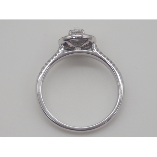 230 - A new platinum + diamond ring, centre stone is 0.50ct, shoulder diamonds 0.20ct, clarity G/VS, new c... 