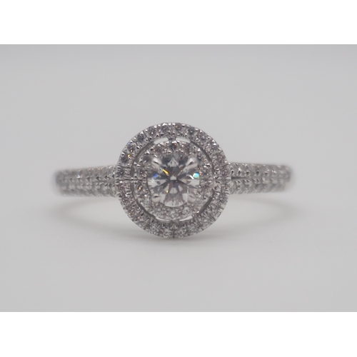 230 - A new platinum + diamond ring, centre stone is 0.50ct, shoulder diamonds 0.20ct, clarity G/VS, new c... 