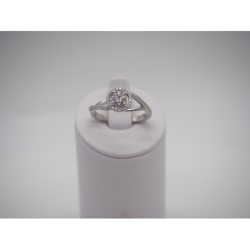 231 - An new 18ct white gold diamond ring,  0.25ct centre stone, 0.24ct shoulders,