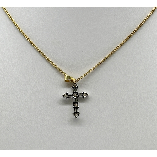 229 - An 18ct yellow gold cross pendant & chain, cross is white gold with diamonds, approx 0.50ct diamond,... 