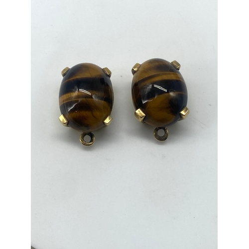 81 - A pair of 18ct yellow gold tigers eye drop earrings, the earrings drop wires will need replacing, no... 