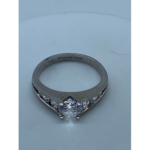 143 - A 9ct white gold cz stone set ring,
size R,
weight is 4.6 grams approx,
inside band engraved true di... 