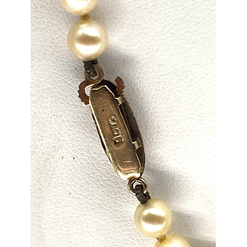 348 - A 9ct yellow gold clasp on cultured pear necklace,  

5 - 6mm pearls