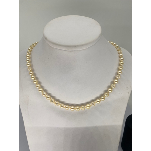 348 - A 9ct yellow gold clasp on cultured pear necklace,  

5 - 6mm pearls