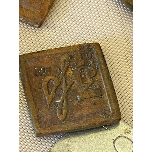 121 - A collection of postal stamp weights