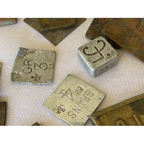 121 - A collection of postal stamp weights