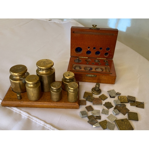 121 - A collection of postal stamp weights