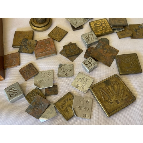 121 - A collection of postal stamp weights