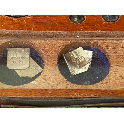 121 - A collection of postal stamp weights
