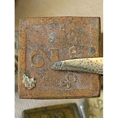 121 - A collection of postal stamp weights