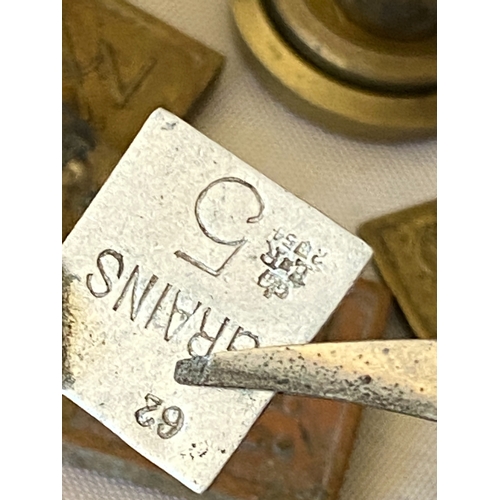 121 - A collection of postal stamp weights