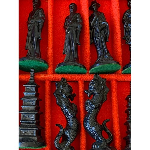 126 - An oriental carved chess set