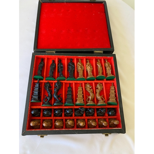 126 - An oriental carved chess set