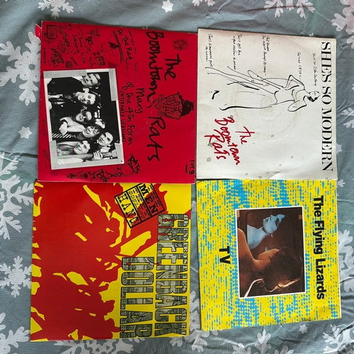 This collection comprises eight vintage 7-inch vinyl single records ...