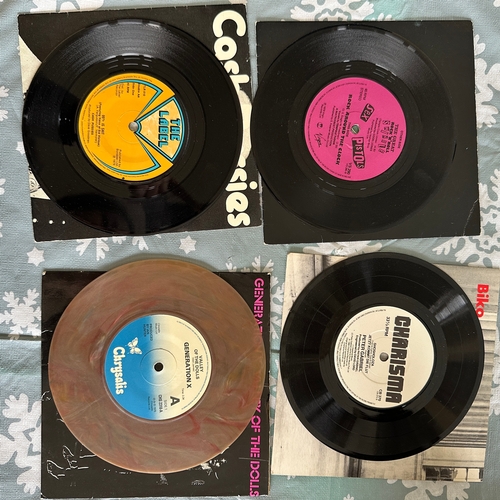 A collection of eight 7-inch vinyl single records, primarily from the ...