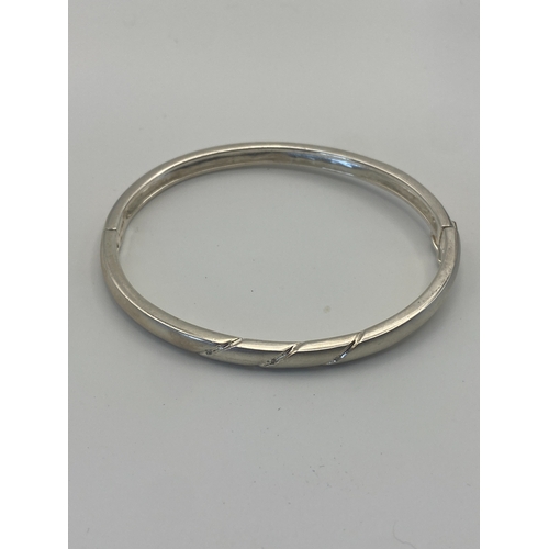 325 - A Newbridge silverware open cuff bangle with a box & a vintage silver bangle