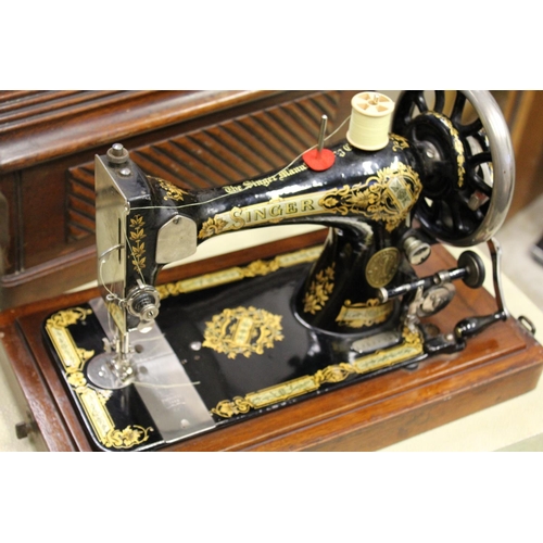 101 - A cased sewing machine.