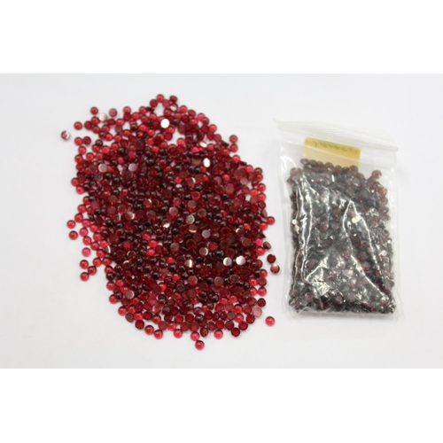 1012 - A small bag of red coloured gemstones.