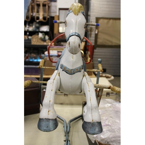 108 - A 1960's / 70's metal rocking horse on sprung frame.