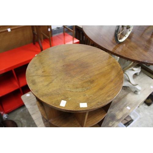 159 - A walnut circular revolving table / bookcase.