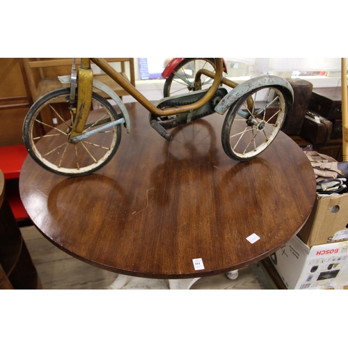 161 - A circular dining table with polished hardwood top and decorative painted base.