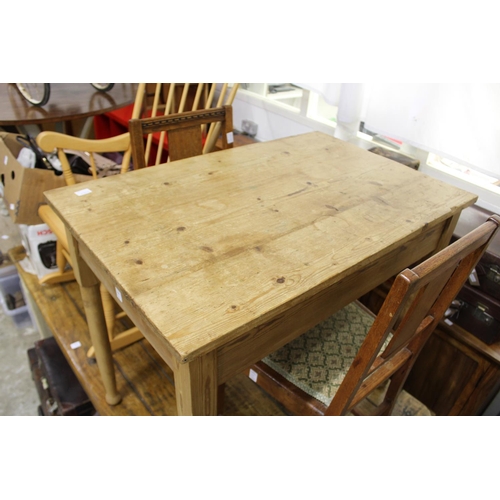 166 - A small pine table and a pair of oak chairs.