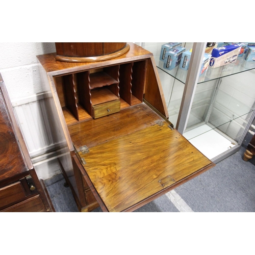 199 - A small walnut bureau.