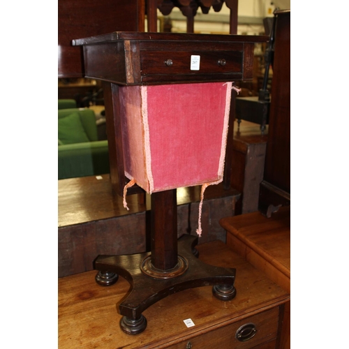 207 - A 19th century rosewood work table.