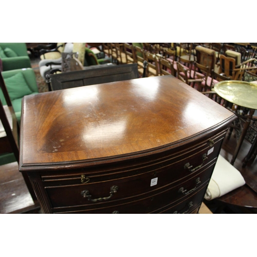 209 - A George III style mahogany bow front four drawer chest with brushing slide.