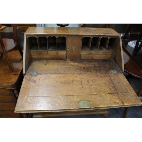 230 - A George III oak bureau.