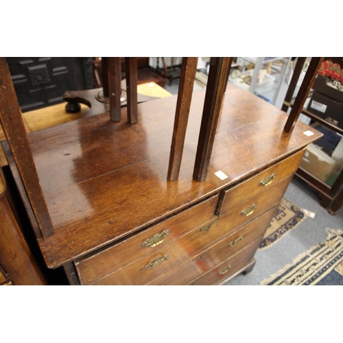 238 - A George III oak chest of two short and three graduated long drawers on bracket feet.