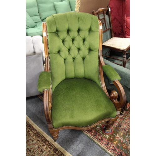 249 - A Victorian walnut framed armchair with button upholstered back.