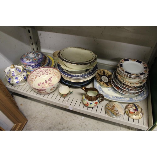 26 - A shelf of decorative china.