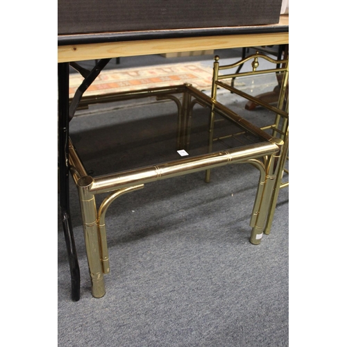 270 - A brass faux bamboo and smoked glass coffee table together with a matching nest of tables.