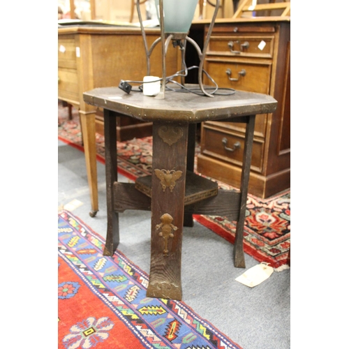 297 - A pair of orientalist oak lamp tables with metal mounts.