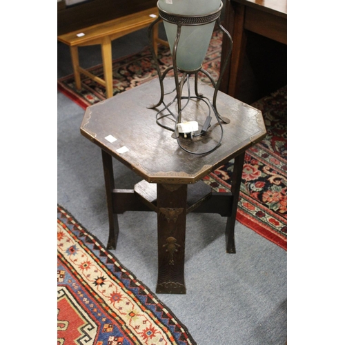 297 - A pair of orientalist oak lamp tables with metal mounts.