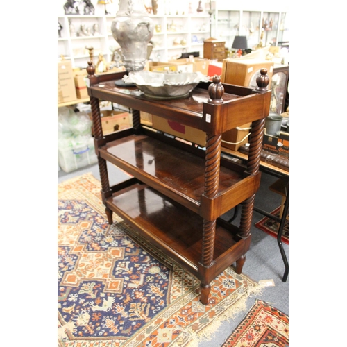 299 - A good mahogany three tier buffet in the Victorian style.