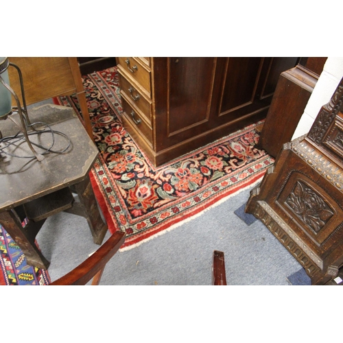 306 - A large Persian design carpet, red ground with broad floral decoration (some wear).