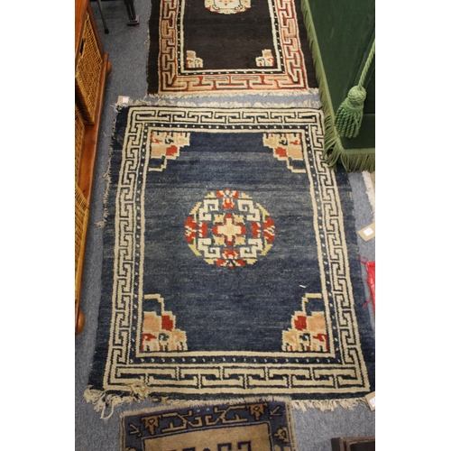 313 - Four small Persian style rugs.