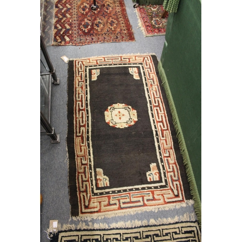 313 - Four small Persian style rugs.