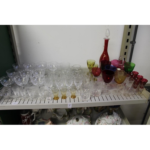 34 - Cut glass champagne glasses, colourful glassware etc.