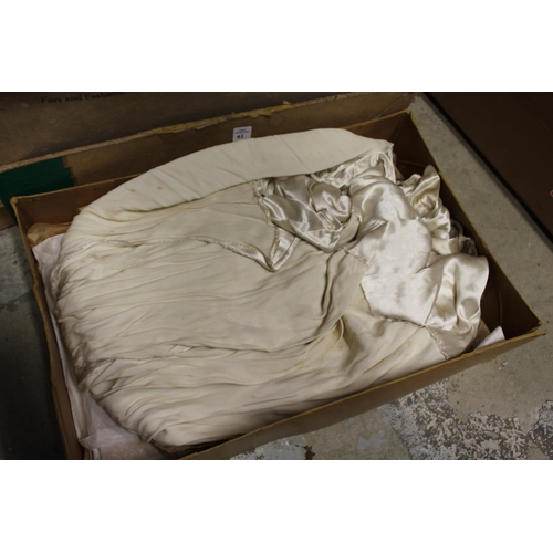 61 - A bridal dress in an old box.