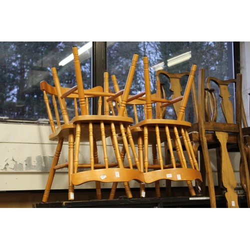 63 - A set of four kitchen chairs.