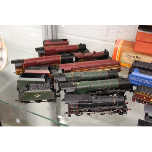 651 - A collection of Hornby double OO gauge trains and carriages.